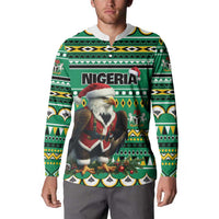 Green Christmas sweatshirt worn on model with Nigeria print and eagle-Santa graphic