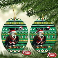 Green ceramic round ornament pair with Nigeria pattern and Santa figure, hanging from gold loops