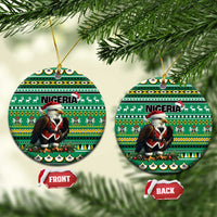 Green ceramic round Christmas ornament with Nigeria pattern, Santa figure, gold loop, two views