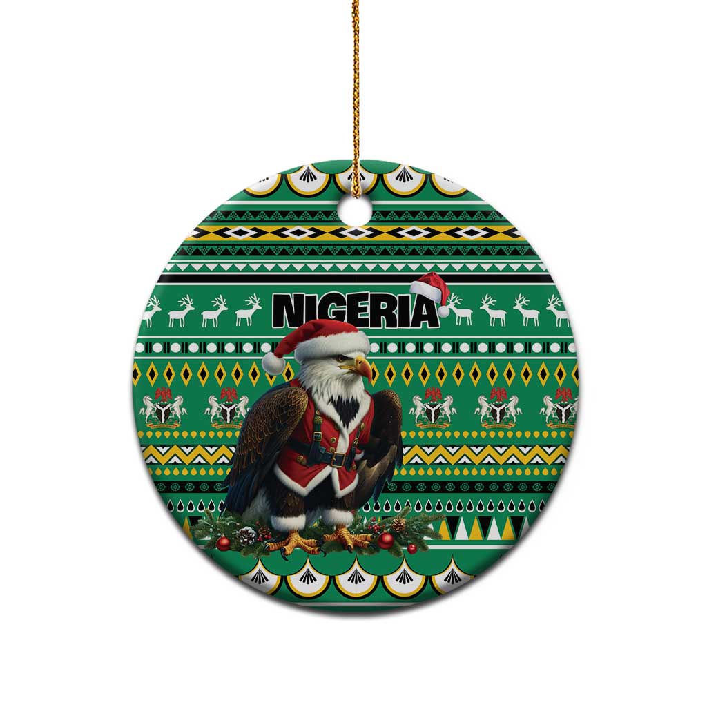 Green ceramic round ornament with Nigeria pattern and Santa figure, hanging from gold loop