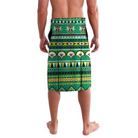 Green wrap-style lavalava shorts with Christmas reindeer, trees, and geometric bands