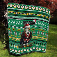 Green quilt featuring Eagle Santa, Nigeria wordmark, reindeer rows, and patterned bands