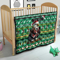 Green kids bed quilt showing Eagle Santa, Nigeria text, reindeer motifs, and scalloped trim