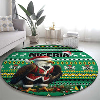 Green round Nigeria carpet with eagle Santa graphic, bold geometric African pattern