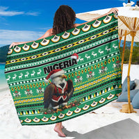 Green Nigeria-themed patterned sarong with Santa and eagle motifs, folded wrap