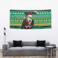 Green wall-hung tapestry with Santa eagle, 'NIGERIA' text, and patterned animals and trees