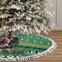 Green circular tree skirt with eagle-and-Santa African pattern and long white fringe