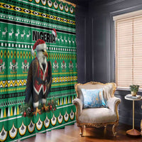 Green window curtain with eagle-and-Santa design and bold geometric stripe bands