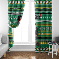 Green festive window curtain panels with eagle-and-Santa and tribal stripe motifs