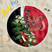 Round Yemen-themed beach blanket with flag colors and fringed edge, floral emblem design