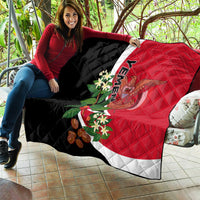 Yemen Unification Day 2024 quilt held on patio, red and black with white band and emblem