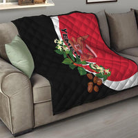 Yemen Unification Day 2024 quilt draped on sofa, red and black flag design with emblem