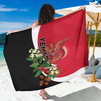Red and black flag-style sarong showing Yemen text and coat-of-arms graphic