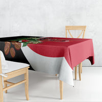 Red, black, and white diagonal tablecloth with Yemen crest and floral design.