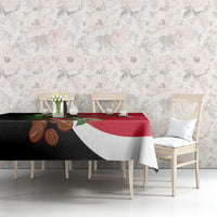 Red and black tablecloth featuring a central Yemen-style crest with floral details.