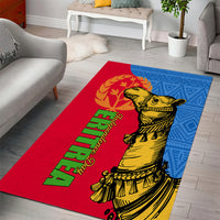 Red and blue area rug with camel figure graphic and green script text