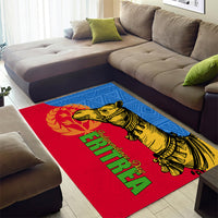 Red and blue area rug with large camel artwork and green decorative lettering