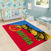 Red and blue area rug with camel illustration and green script on blue border