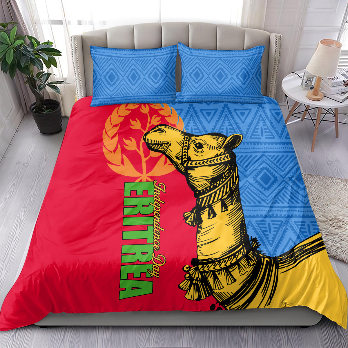 Bedding set with two blue geometric pillows and red duvet with yellow camel and green text