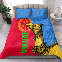 Bedding set with two blue geometric pillows and red duvet with yellow camel and green text