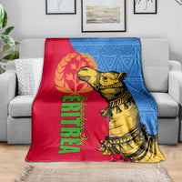 Eritrea Independence Day blanket on sofa, red and blue with gold camel graphic