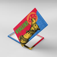 Canvas wall art shown at an angle with yellow camel, green red text, and blue geometric pattern