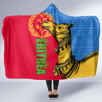 Hooded blanket with blue geometric pattern, red panel, camel graphic, and green text