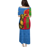 Blue long dress with back-facing camel graphic, red green yellow Eritrea lettering