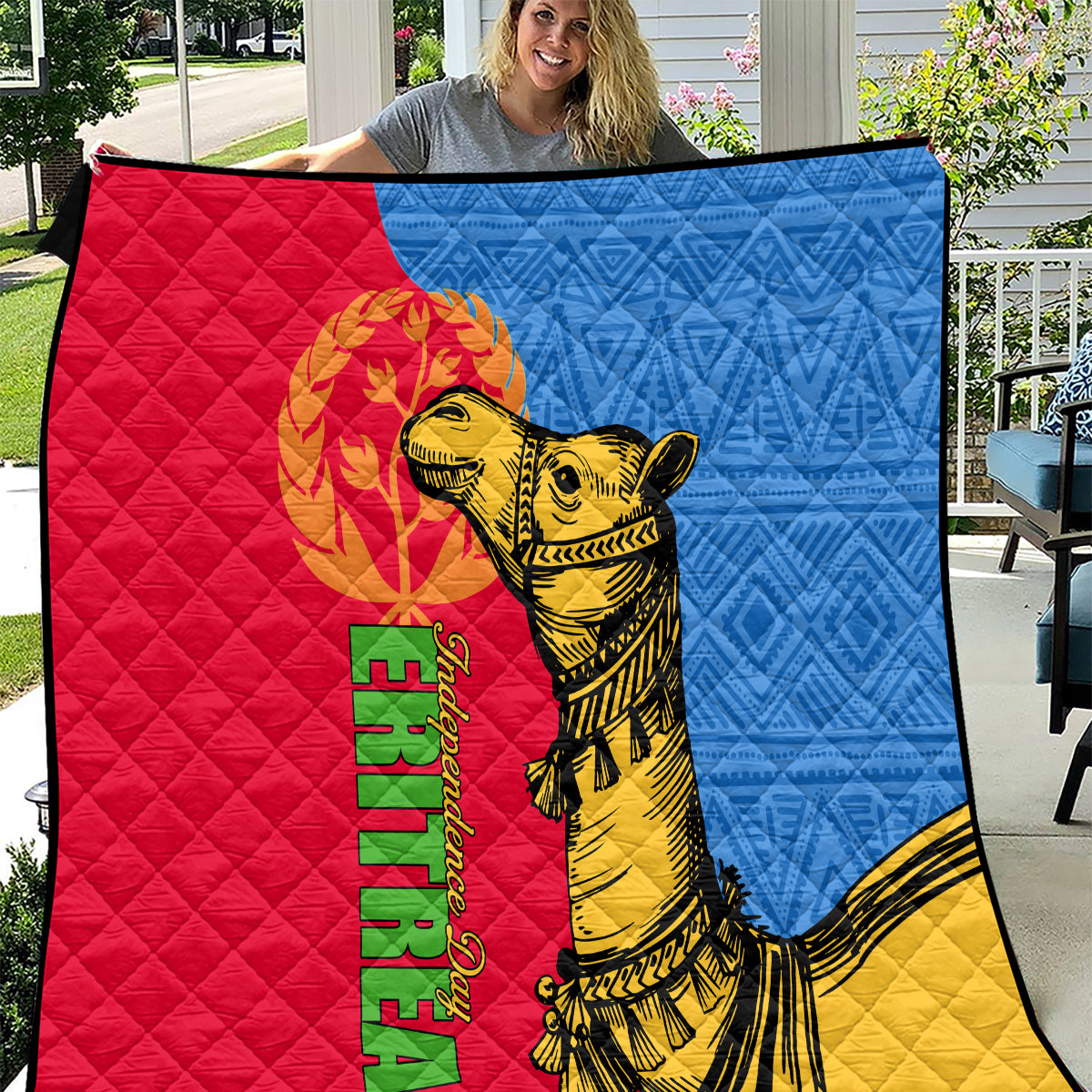 Tri-color quilt with quilted diamond pattern and golden camel with Eritrea text.