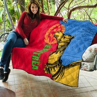 Large quilt laid on couch: red-blue-yellow panels with golden camel graphic and text.