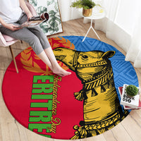 Round area rug with red, blue, and yellow pattern featuring camel artwork and green text