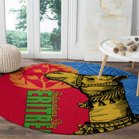 Round rug with red and blue geometric border, camel illustration in yellow with black details