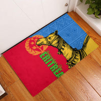 Rubber doormat with yellow camel illustration on red, blue, and yellow background with green lettering