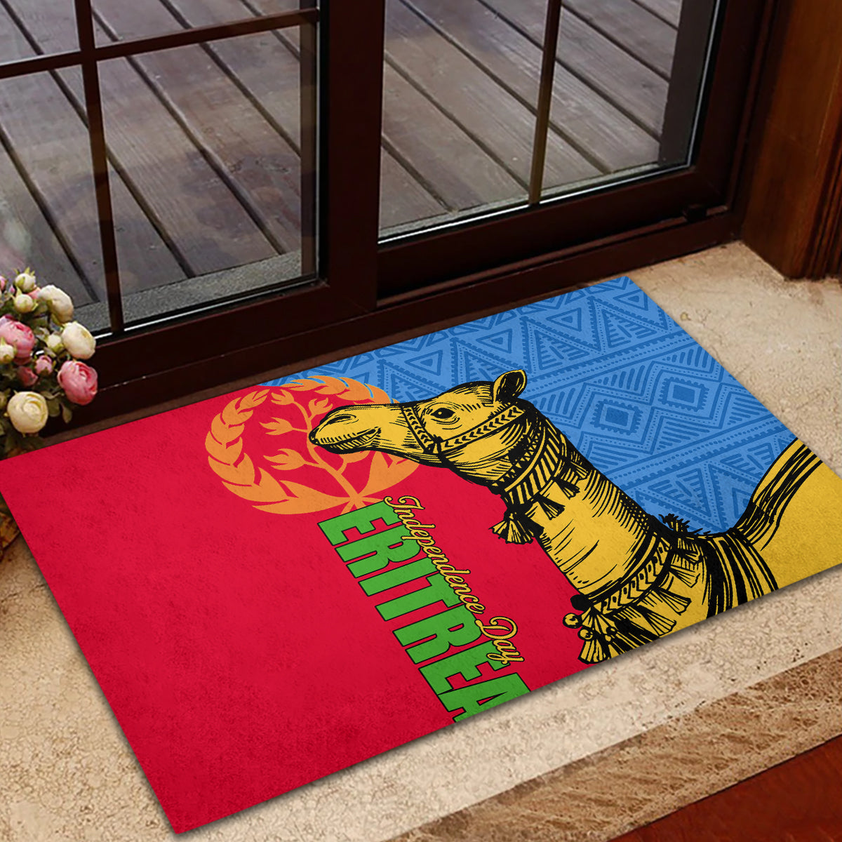 Rubber doormat with yellow camel illustration on red, blue, and yellow panels with green lettering