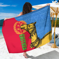 Camel illustration sarong fabric with blue geometric texture, red panel, and green text