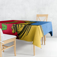 Camel patterned tablecloth draped over table, red yellow and blue geometric stripes