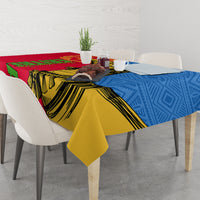 Camel African pattern tablecloth with red, yellow, and blue drape on dining table