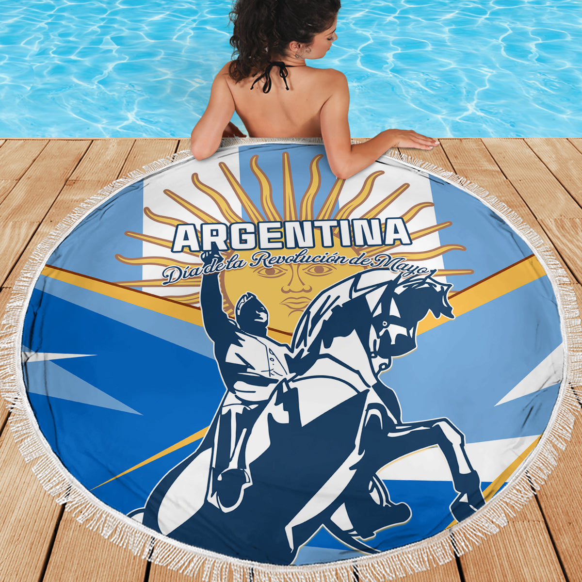 Circular Argentina beach blanket in blue with tassel fringe and revolution artwork