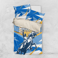 Blue and white Argentina bedding set with rider illustration and two pillow shams on neutral background.