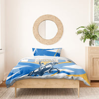 Blue Argentina bedding set with sunburst rays, rider emblem, and matching pillow shams.