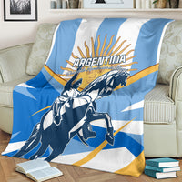 Blue and white Argentina blanket with radiant sun graphic and rider