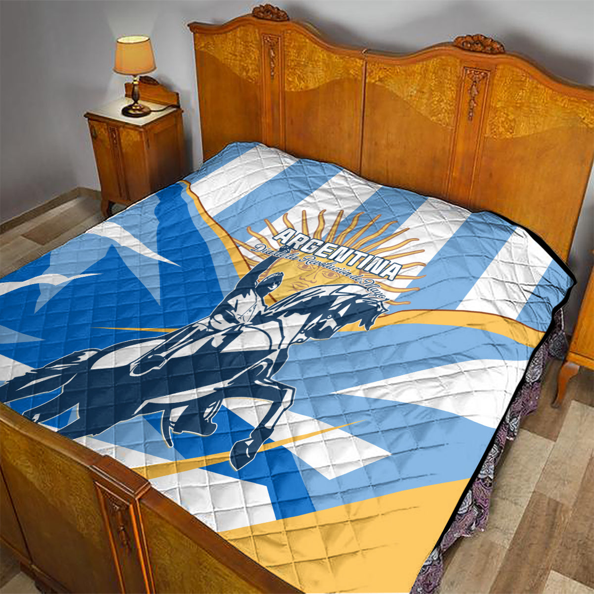 Quilted Argentina Revolution Day quilt in blue, white, and yellow on a bed