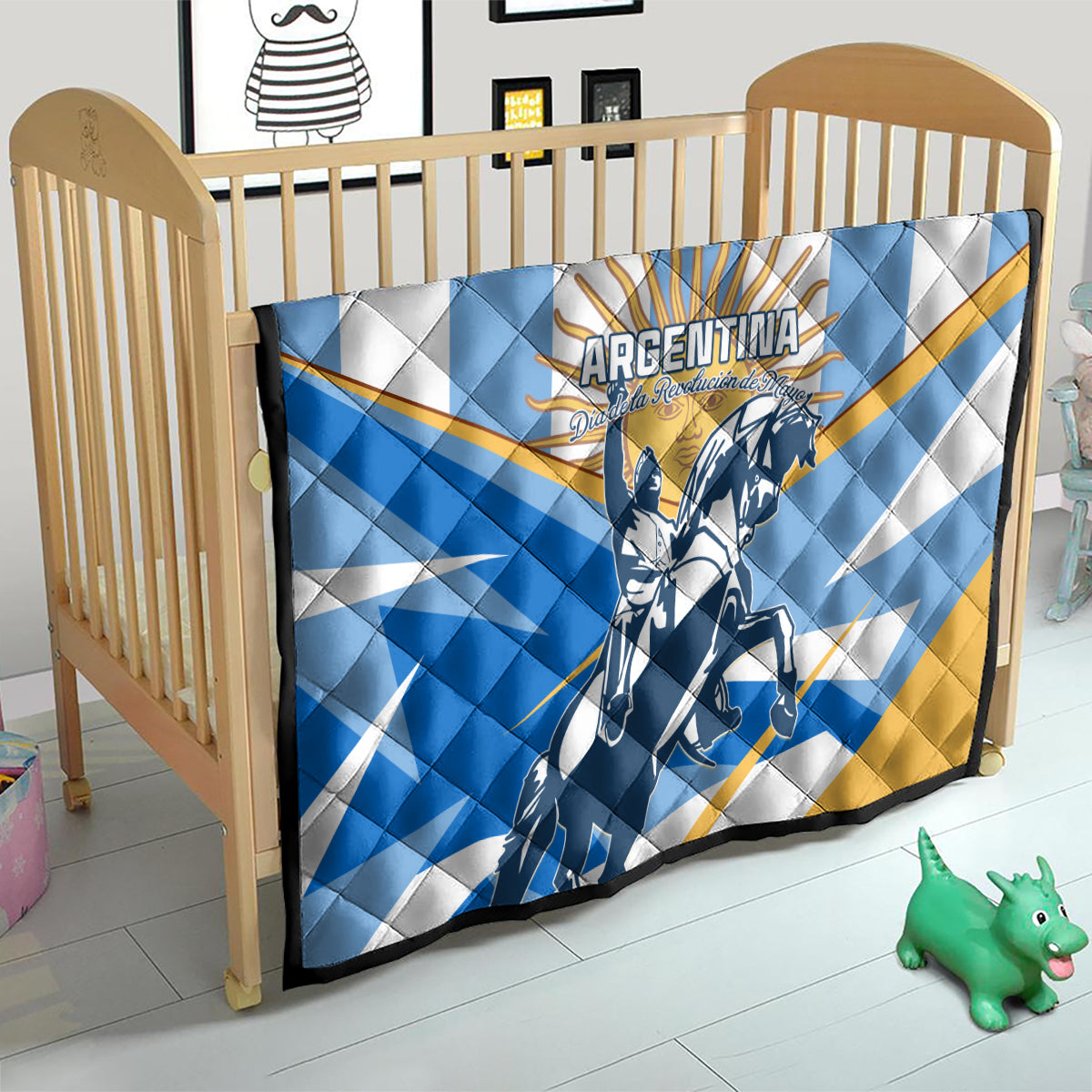 Argentina quilt on a wooden crib, blue and white with yellow accents and rider artwork