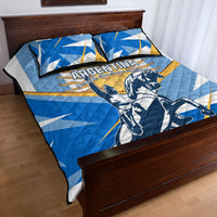Blue and white quilt with gold accents and Argentina warrior emblem, on bed