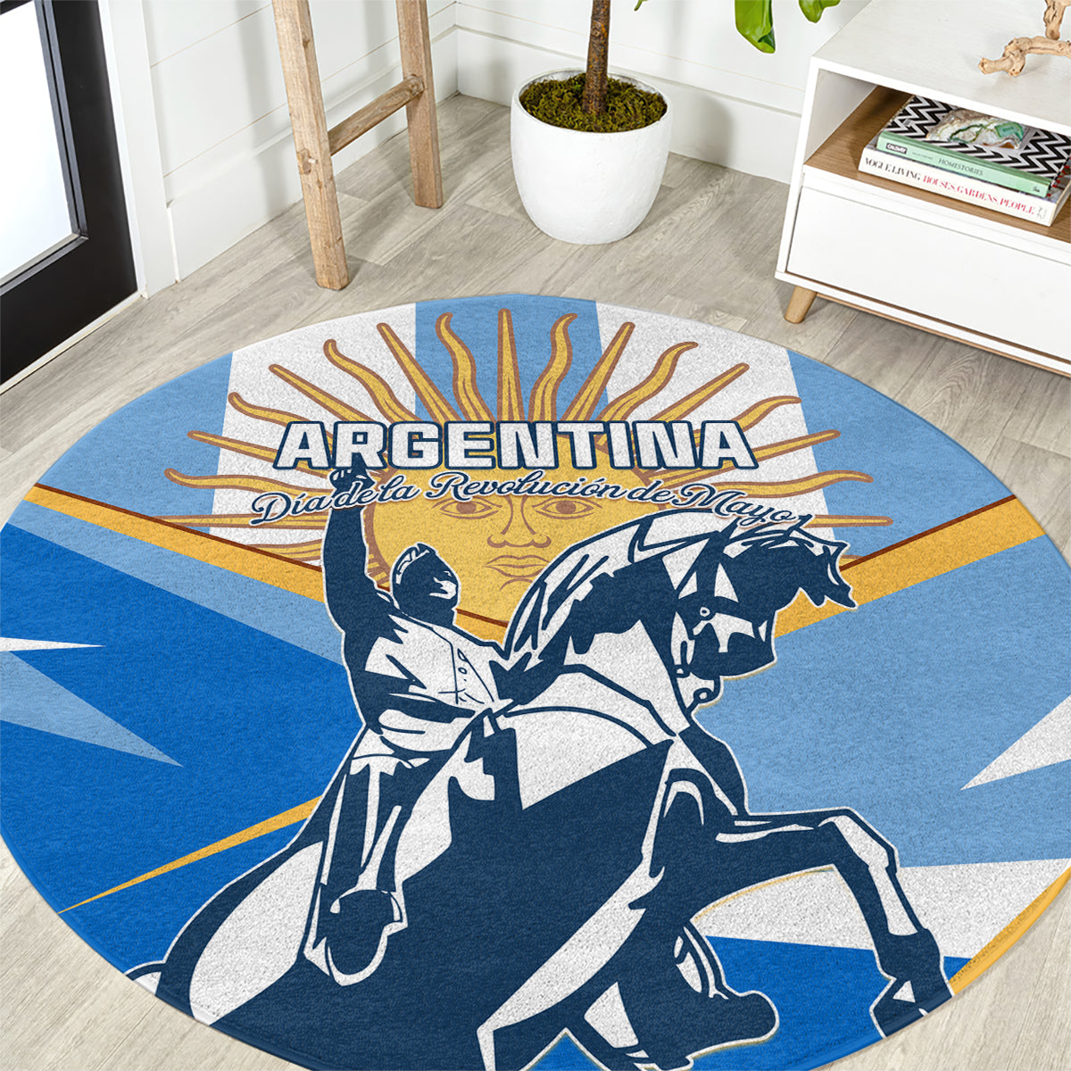 Blue round carpet with Argentina wordmark and revolution figures on horseback in navy and white