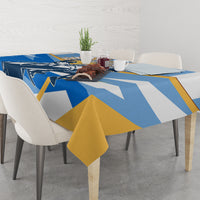 Blue tablecloth with Argentina graphic and gold drape detail on dining table