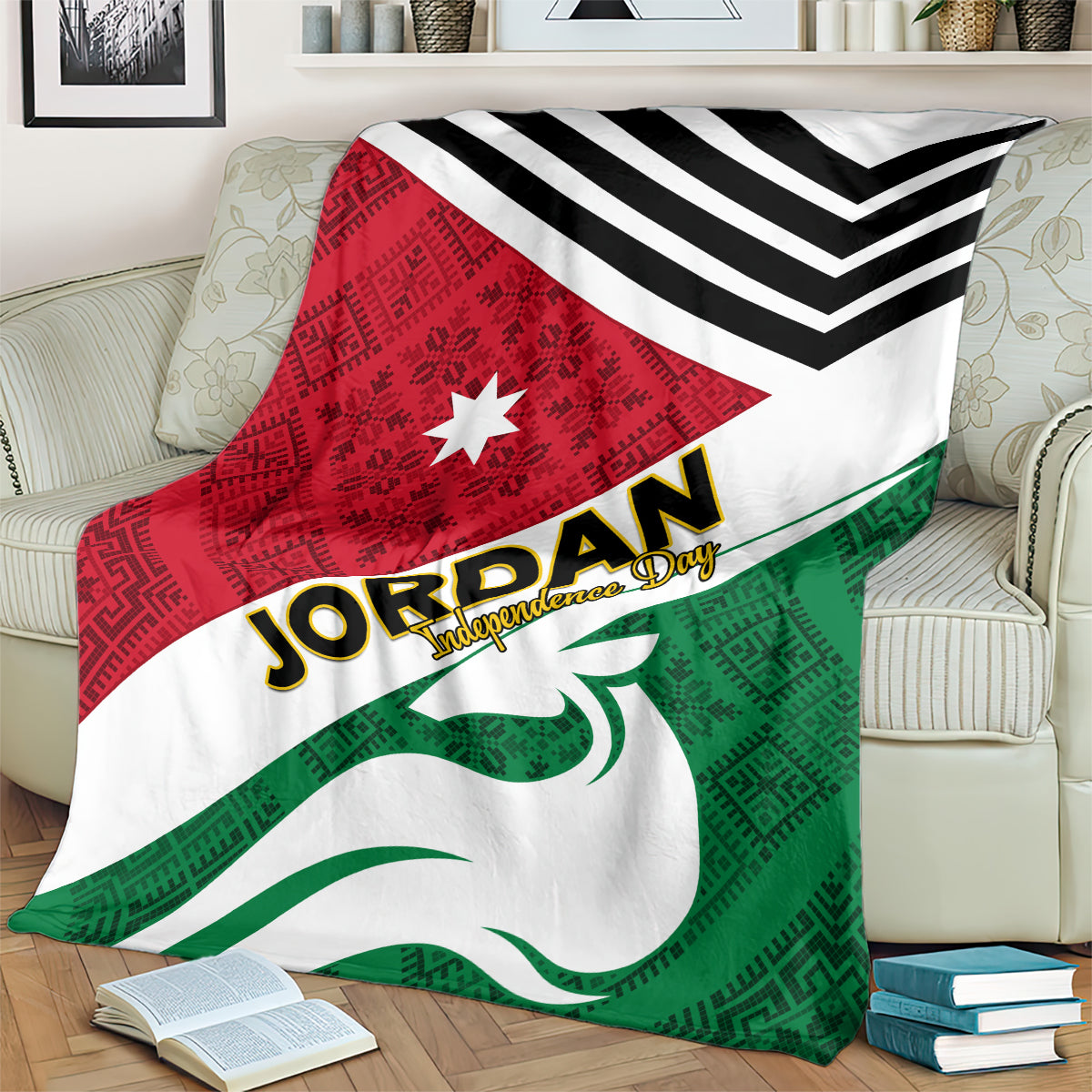 Jordan folk pattern blanket on sofa with black chevrons, red star panel, and green emblem