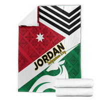 Jordan folk pattern blanket laid flat with red star panel, black chevron stripes, green emblem