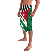 Folk patterned skirt with green, black, and red flag-style panels and wave emblem