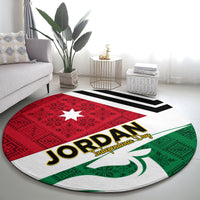 Round rug with red star panel and Jordan Independence Day text; green leaf motif